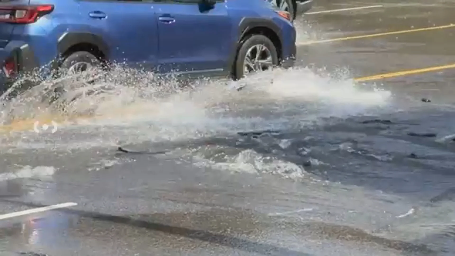 Water main break floods street, appears to damage major roadway in Studio City