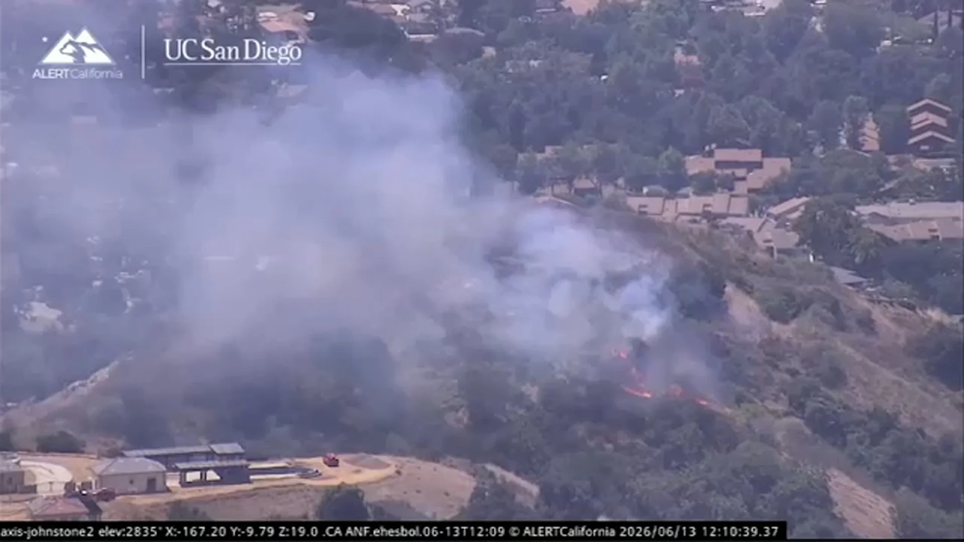 Small brush fire stopped before reaching homes in Glendora; at least 1 structure burned