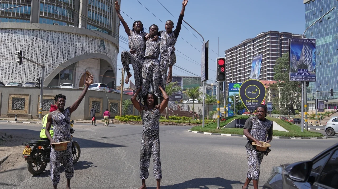 Street acrobats entertain motorists stuck in the Kenyan capital's notorious traffic