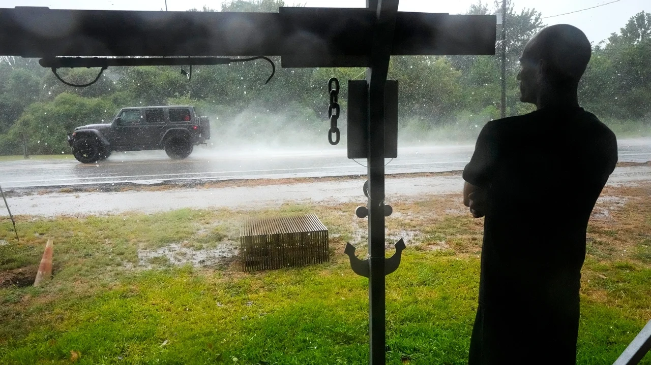 Edouard, now a tropical depression, drenches Texas with flash flooding and downed trees
