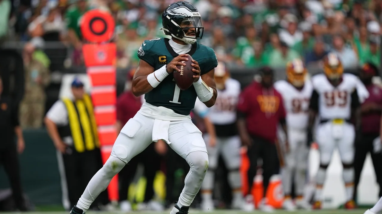 Jalen Hurts throws 3 TD passes and Eagles stuff Commanders' late 2-point try for 24-22 win