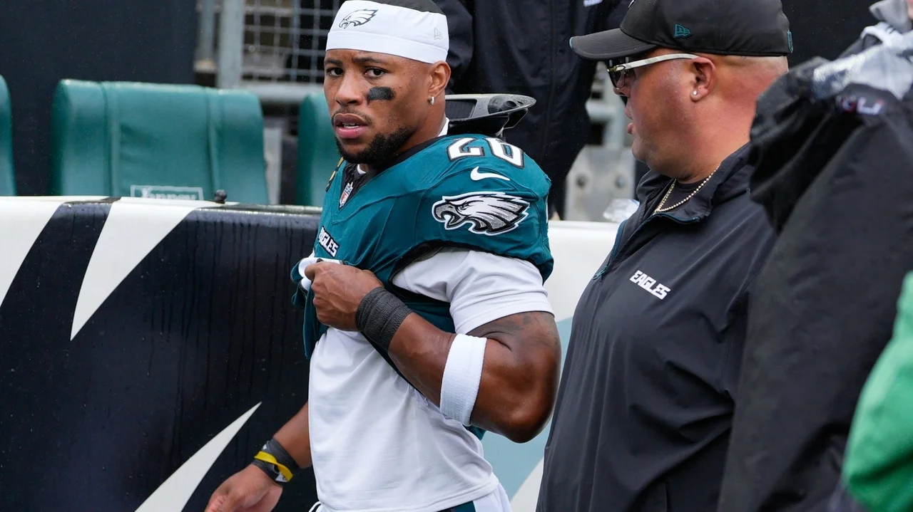 Eagles running back Saquon Barkley leaves game against Rams with apparent hamstring injury