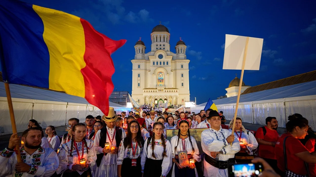 Young Orthodox Christians take part in a lights procession in Romania's capital