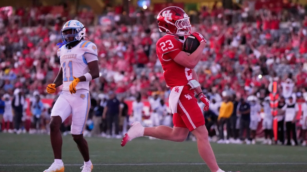 No. 22 Houston routs Southern 77-6 in game played briefly without stadium lights