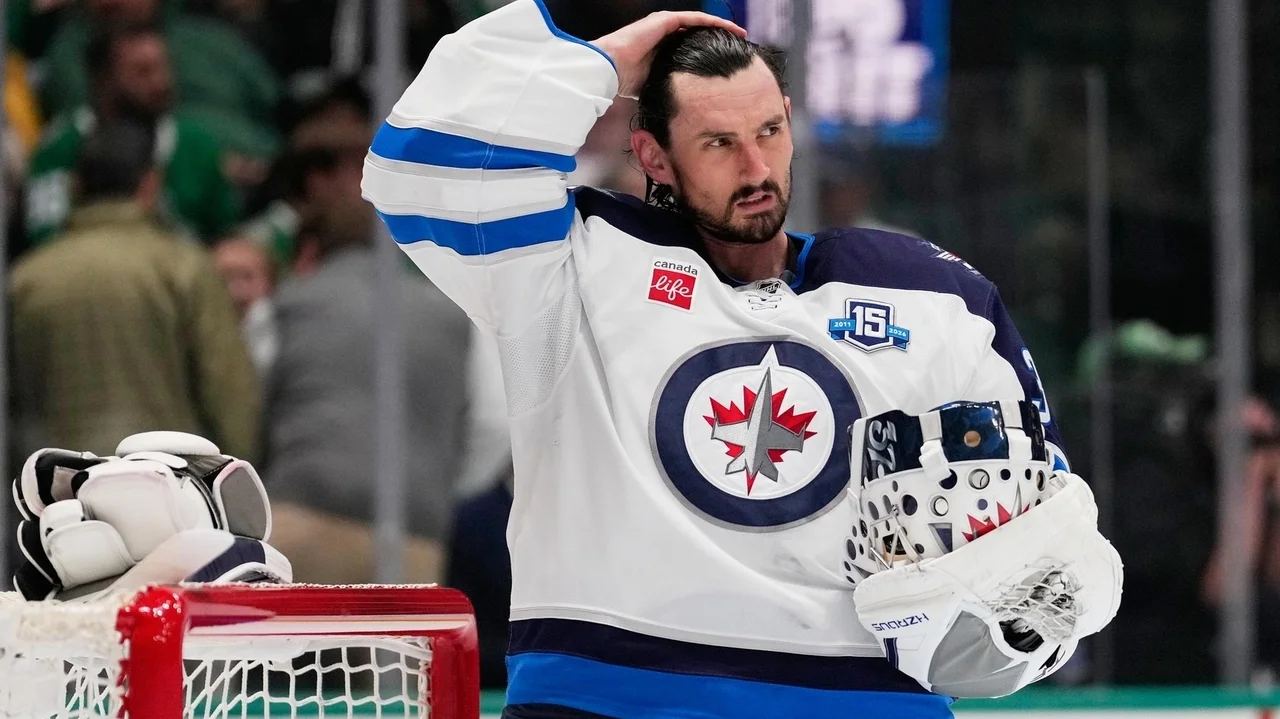 Jets suspend goalie Connor Hellebuyck for failing to report to training camp