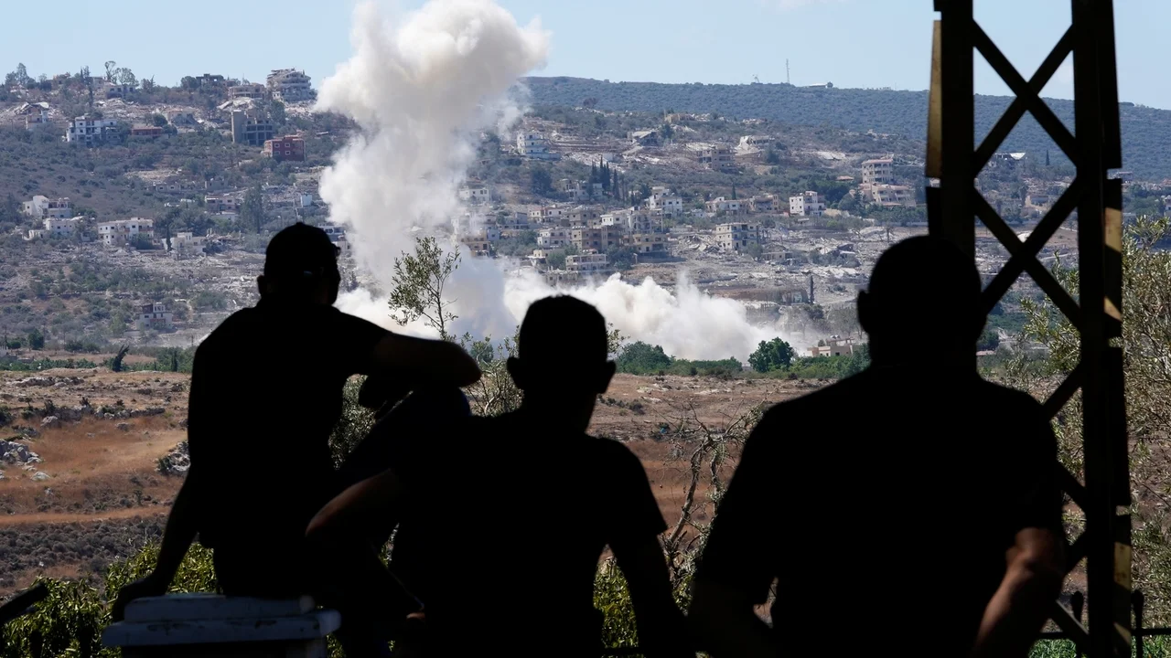 Residents of southern Lebanon gather to watch Israeli drones drop explosives on their village