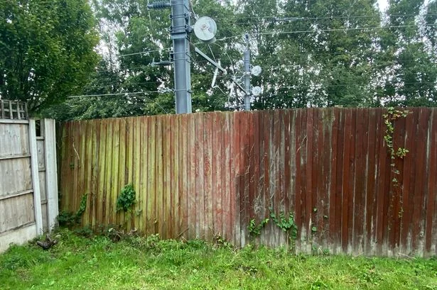 Network Rail row as Rainhill dad fears fence could 'blow onto the track'
