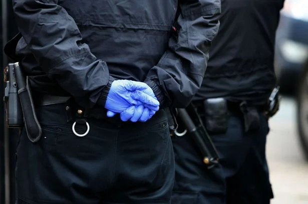 Man arrested after what police found hidden behind his wall in Woolton